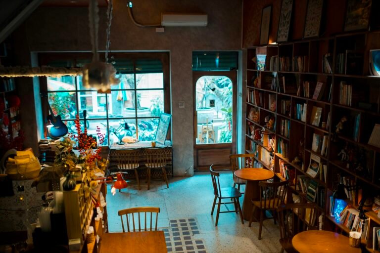 Warm cozy cafe interior with bookshelves and seating