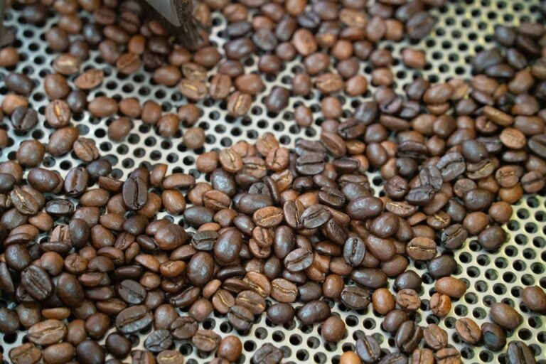 Freshly roasted coffee beans cooling after roasting